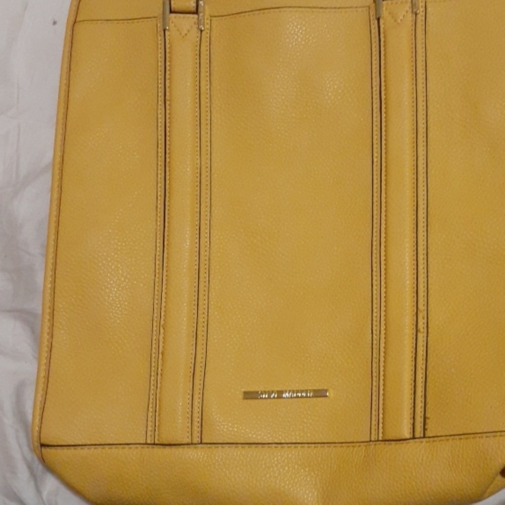A yellow Steve madden purse